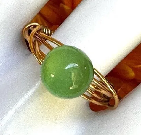 Gold tone green glow bead wire ring