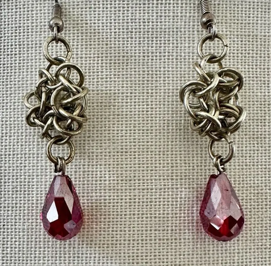Silver tone and red crystal teardrop drop earrings