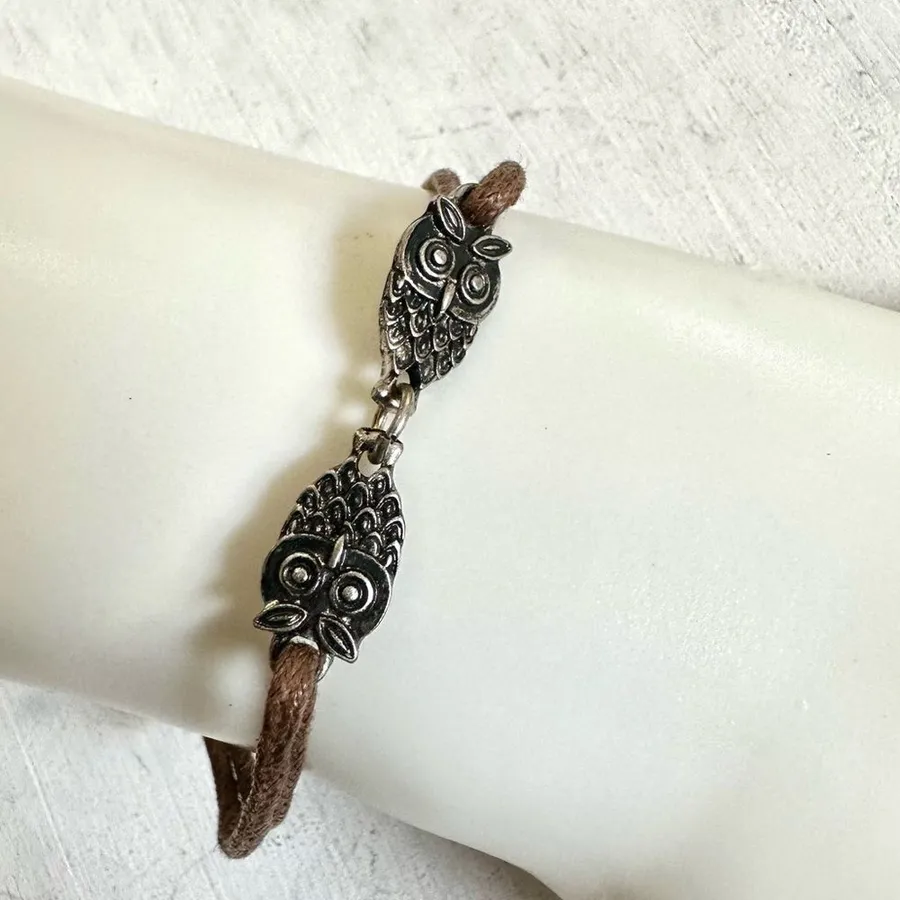 Silver tone owl charm brown cord bracelet
