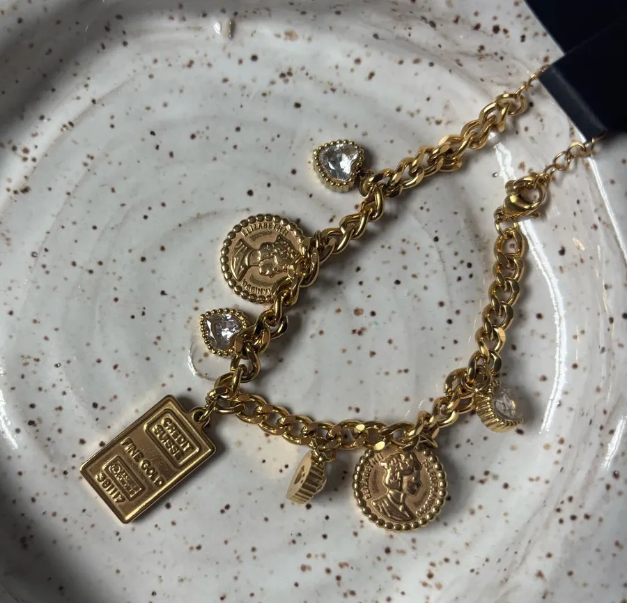 18k Gold multi charm bracelet with adjustable chain