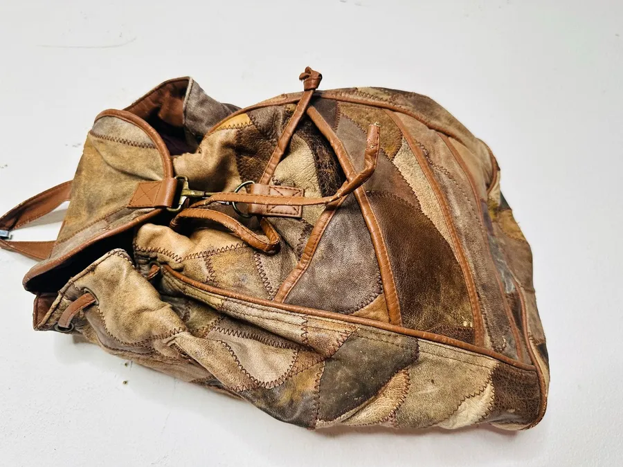 Vintage 1980s/90s Brown Leather Patchwork Clip Front Drawstring Backpack Bag