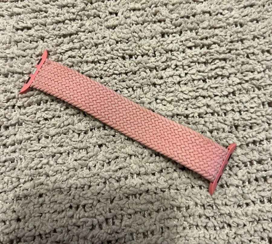 Comfortable pink braided elastic watch band with secure connectors