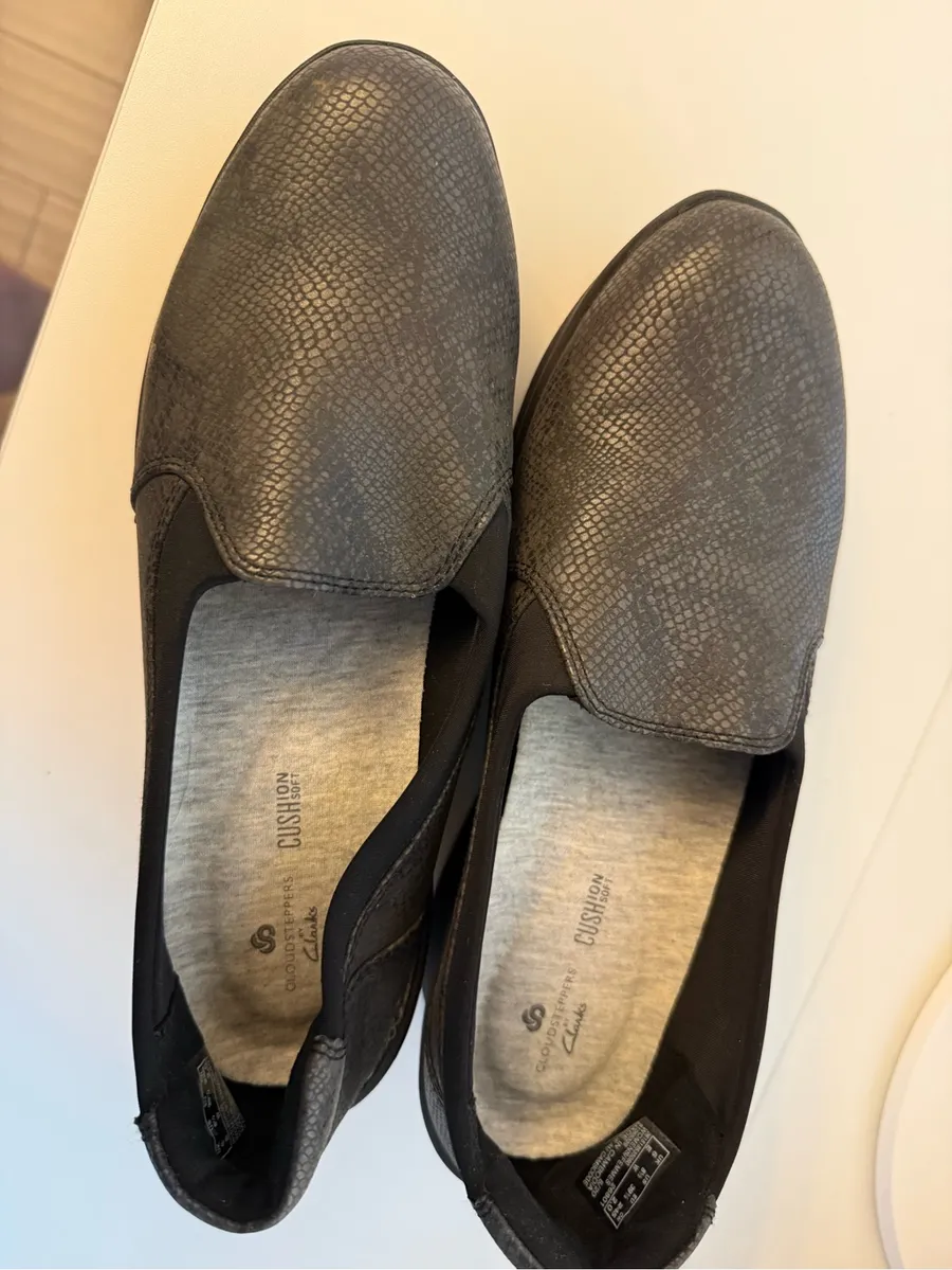Clarks Black Slip-On Loafers with Subtle Snakeskin Texture