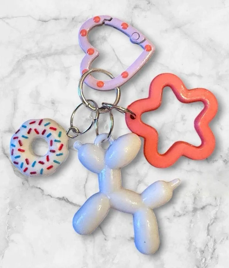 Whimsical White Balloon Dog Keychain with Pink Star & Donut Charms