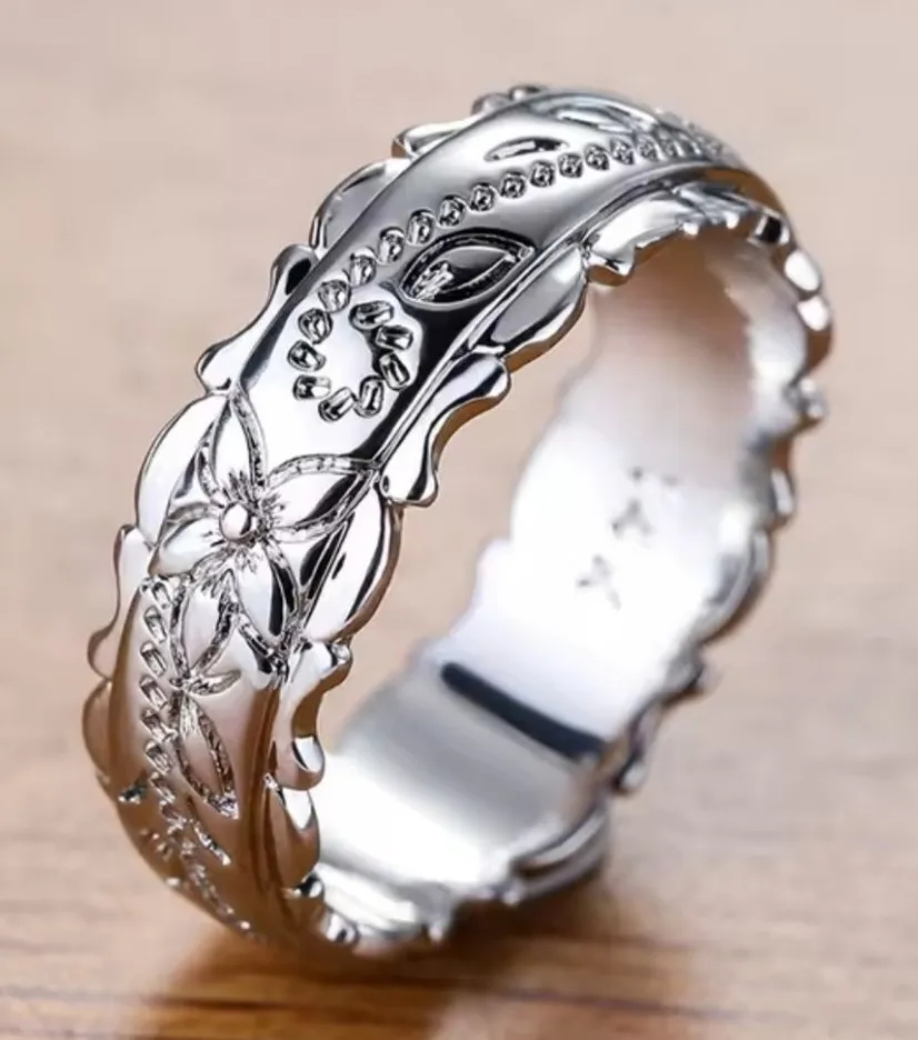 14 Karat White Gold Plated Floral Ring (5) Silver