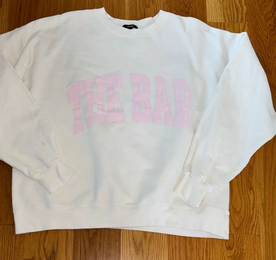 The Bar White Sweatshirt with Pink Lettering