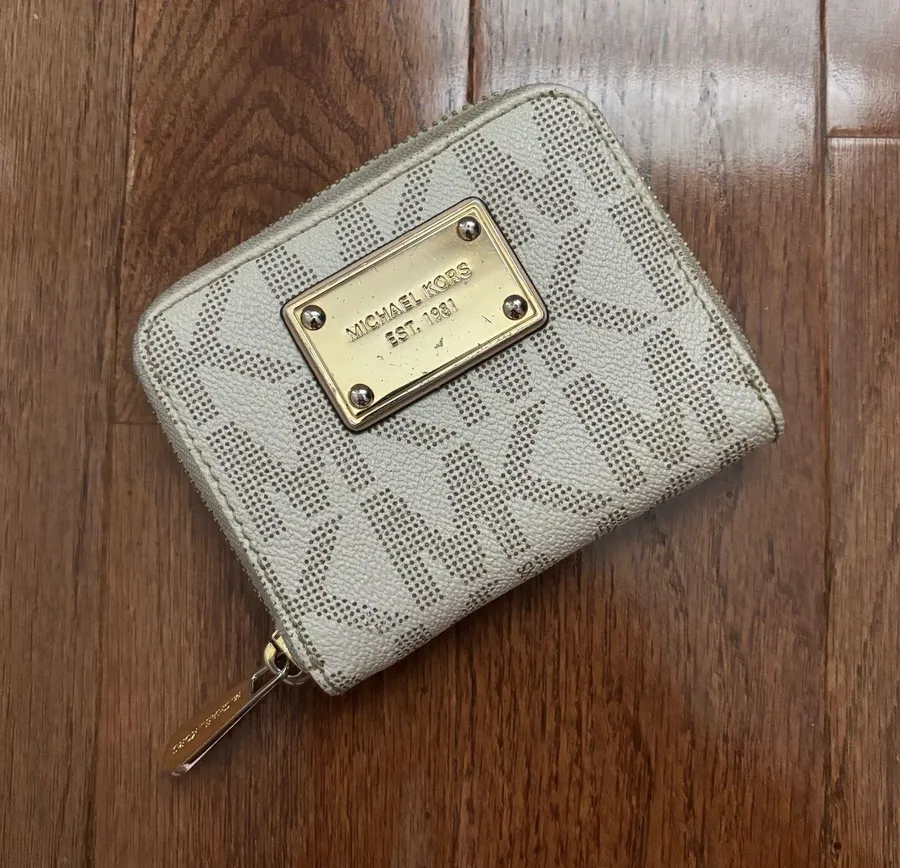 Michael Kors leather monogrammed mini zip around wallet