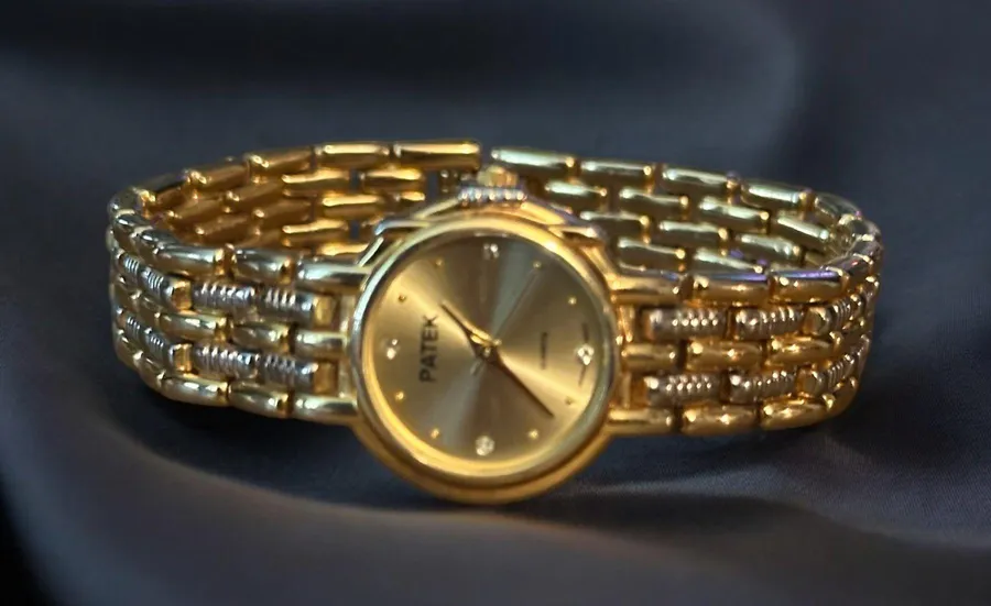 Gold tone basketweave band ladies watch