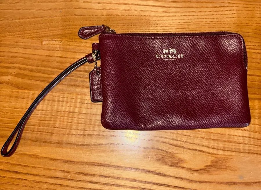 Coach Burgundy Pebbled Leather Wristlet with Gold Logo