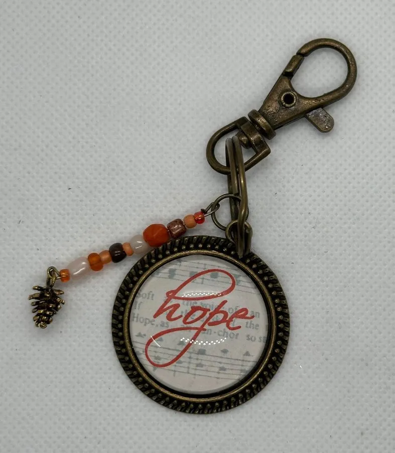Bronze Hope Keychain With Beaded Charm & Pinecone Accent Red