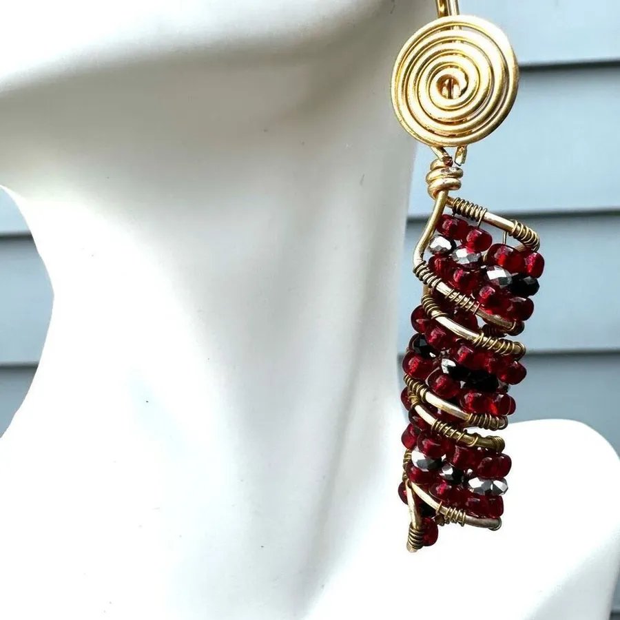 Red beaded gold tone drop earrings