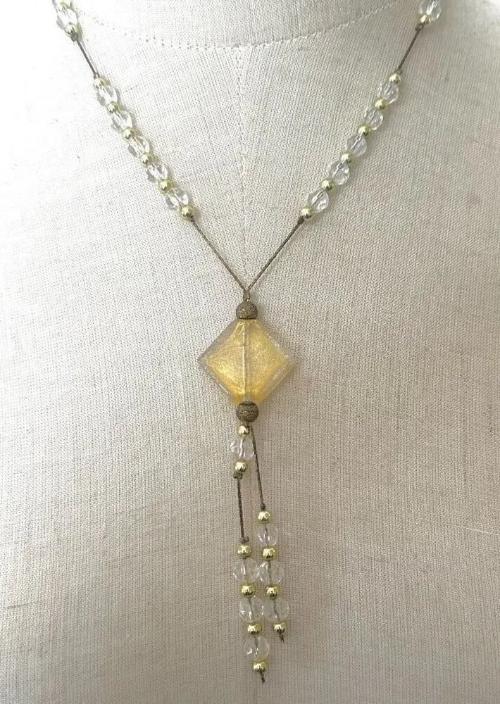 Yellow clear and gold tone beaded pendant necklace