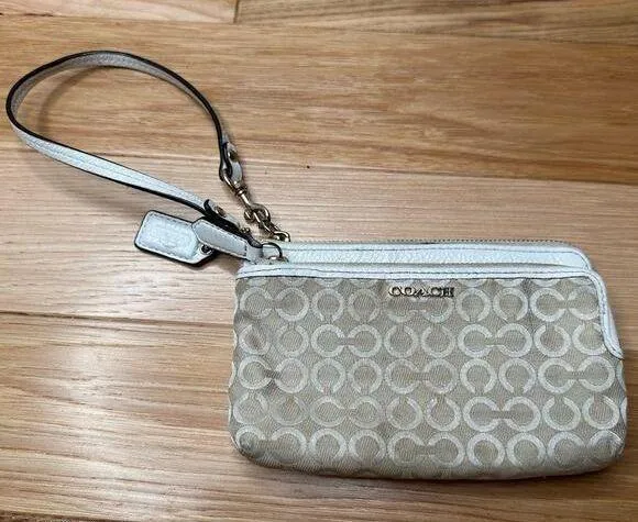 Coach: Tan Graphic Wristlet