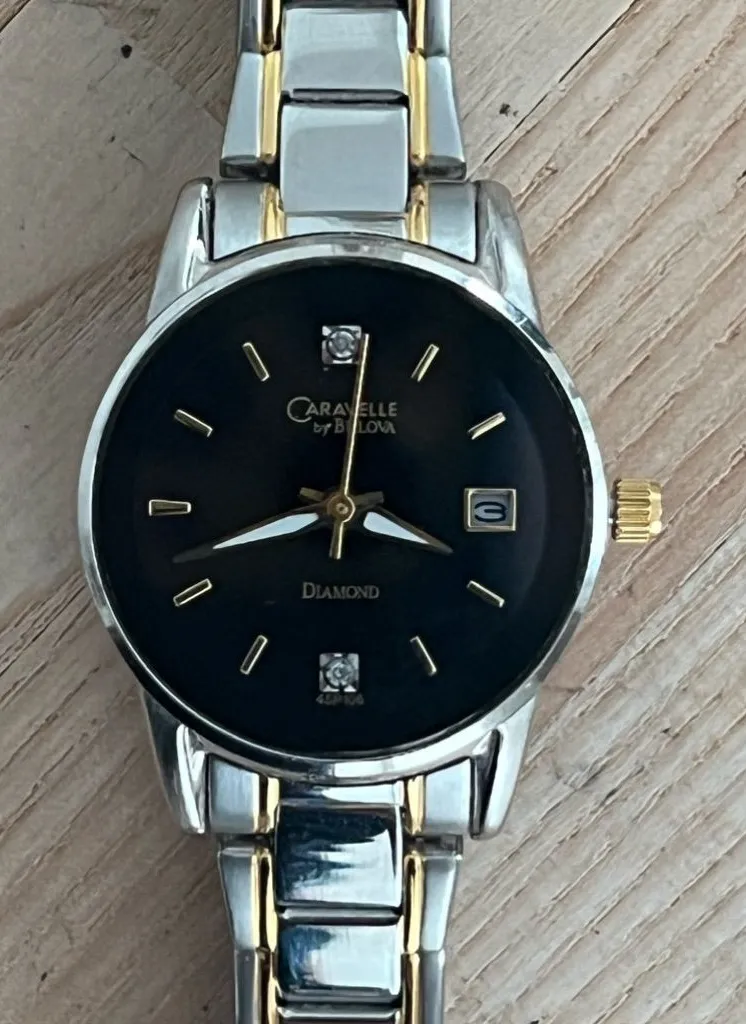 Caravelle by Bulova Ladies Watch Diamonds Black Dial Two Tone Bracelet Silver