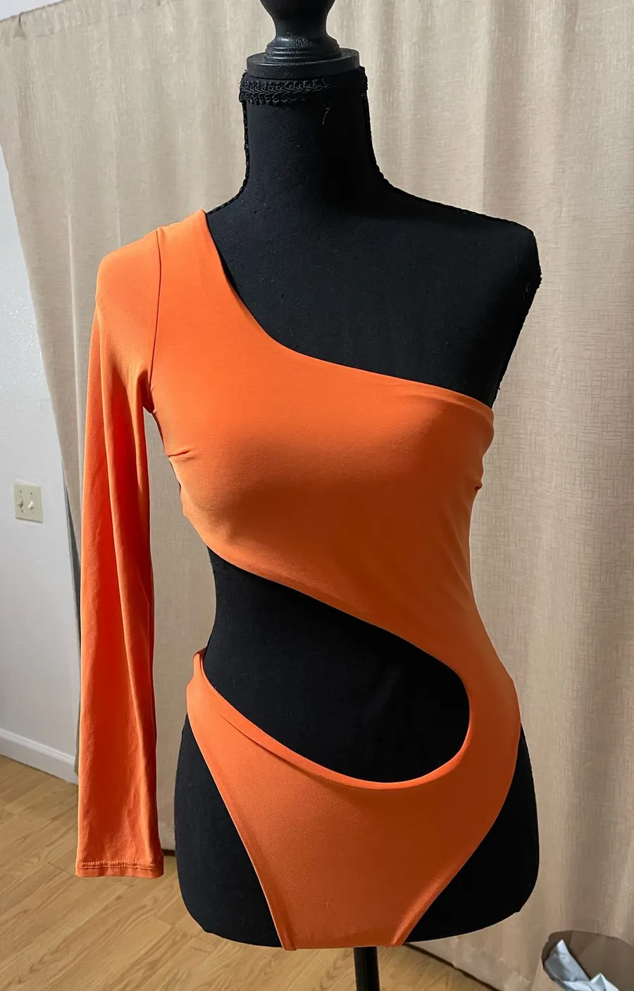 One shoulder orange bodysuit