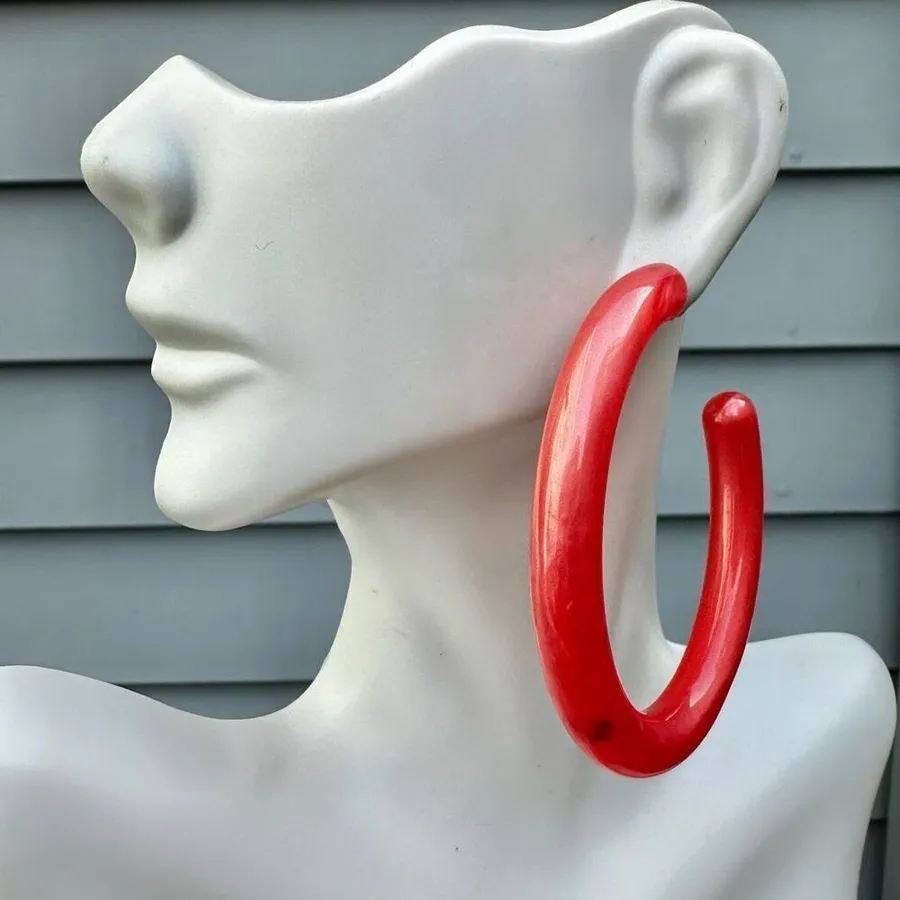 Large pink lucite hoop earrings