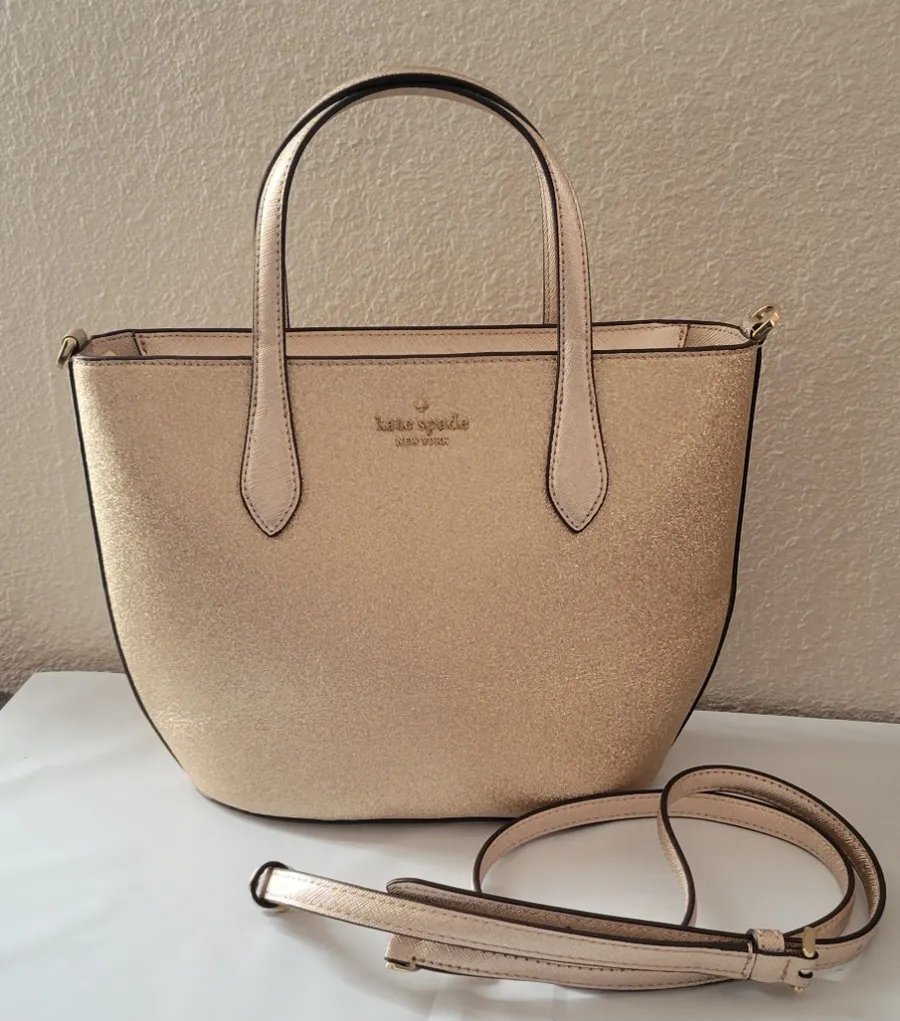 Kate Spade Glimmer Small Satchel in bright rose gold.