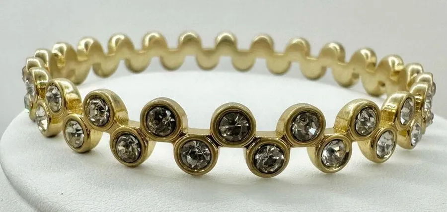 Gold tone and rhinestone bangle bracelet