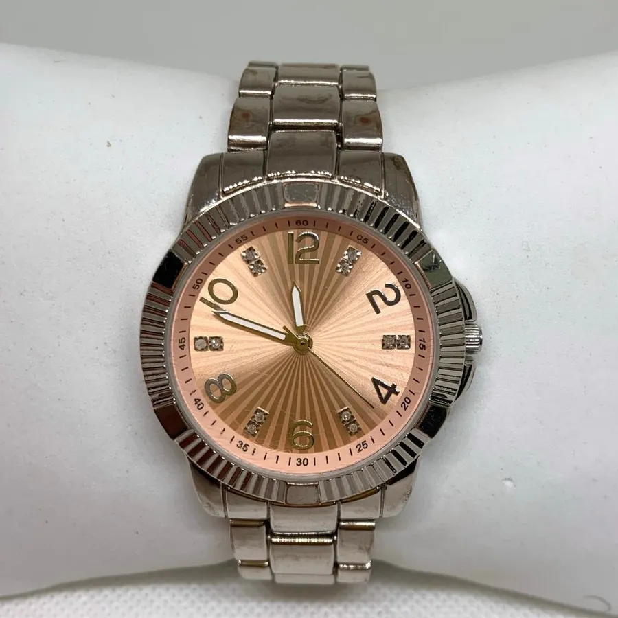 Women’s quartz analog watch silver tone pink dial 36mm round up to 7” running