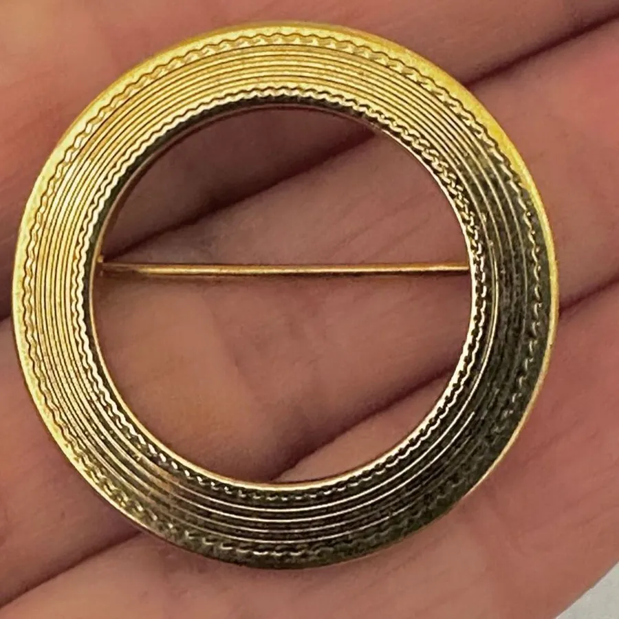 Monet gold tone circle brooch