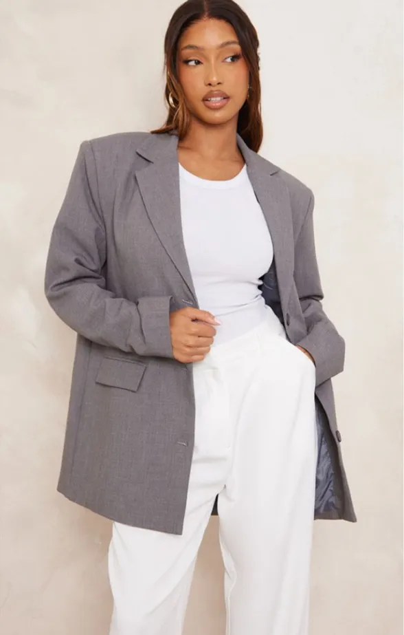 PrettyLittleThing GREY TAILORED WOVEN OVERSIZED DAD BLAZER Size 6 NWT DESCRIPTION Say hello to your new season staple with this grey textured look shoulder padded oversized blazer. Brought to you in a grey textured material with a shoulder pad design and an oversized fit, what more could you want? This blazer is here to banish any of your what to wear dilemmas doll. Style with a white bodysuit, cargo bottoms, and box-fresh kicks for a look that have you setting trend wherever you step foot. Length approx 74cm/20"" (Based on a sample size UK 8) Model wears size UK 8/ EU 36/ AUS 8/ US 4 Model Height - 5ft 7""