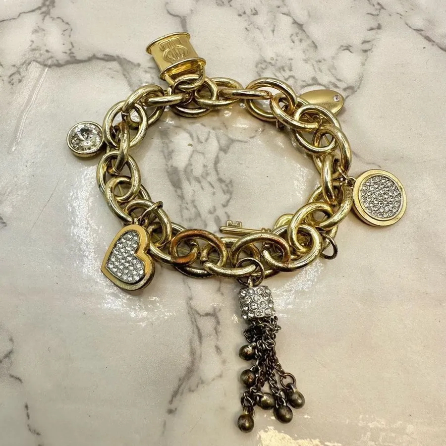 Jennifer Lopez gold tone rhinestone charm bracelet