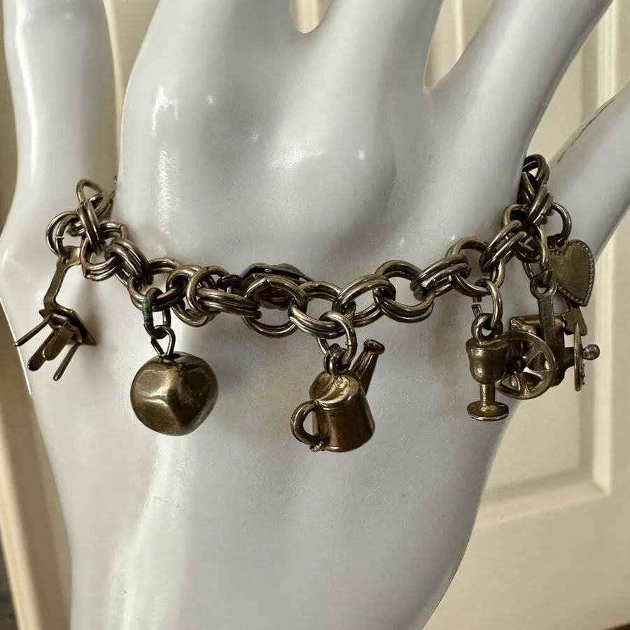 Silver tone charm bracelet Gray