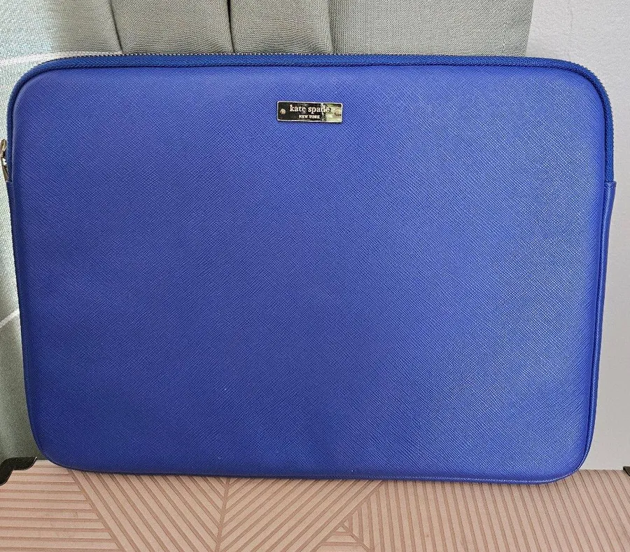 kate spade cobalt blue laptop sleeve with gold logo plaque