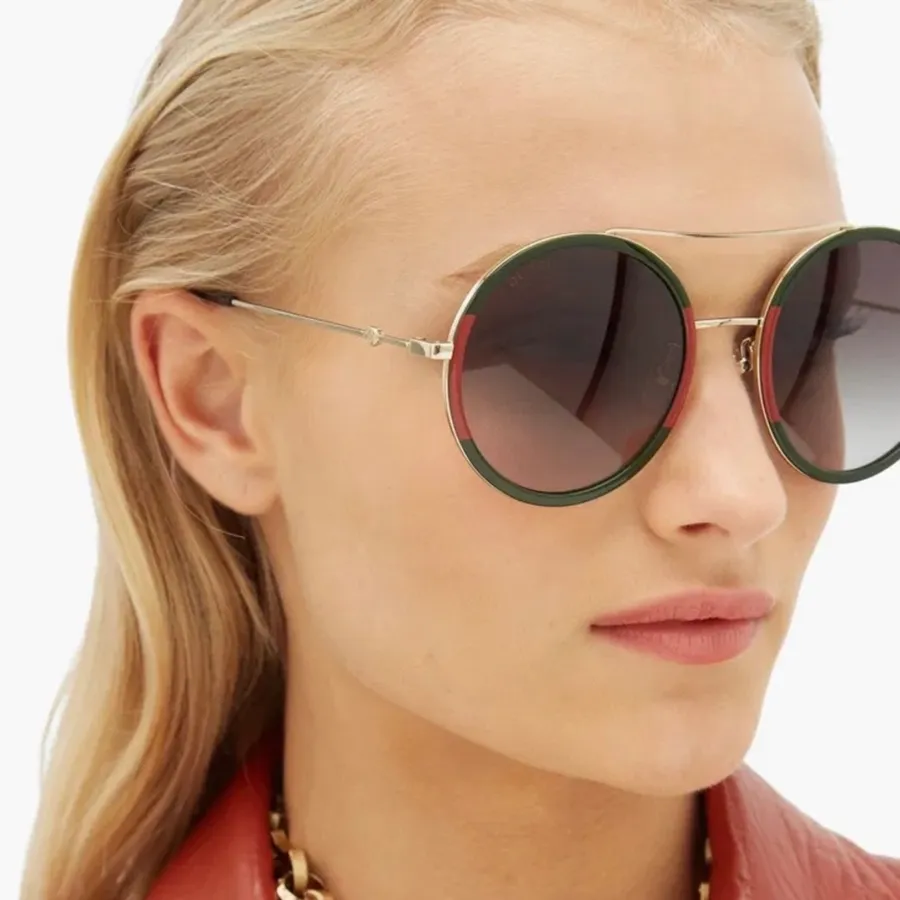 Gucci GG0061S brow bar round sunglasses 56mm gold frames green gradient lenses