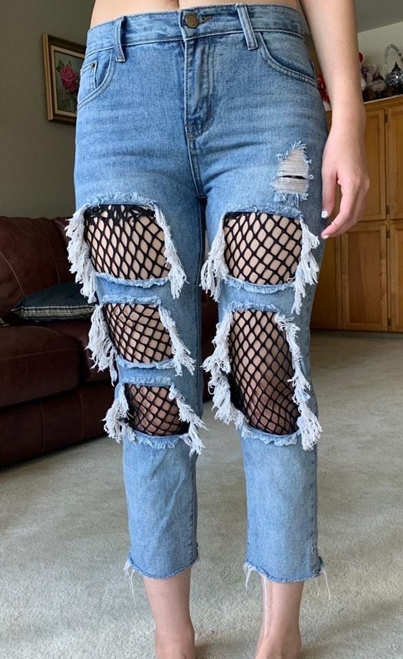 ripped jeans with fishnet