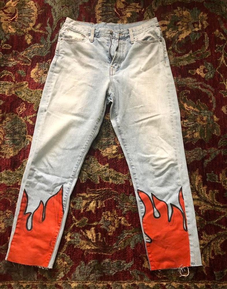 jeans with flames at the bottom