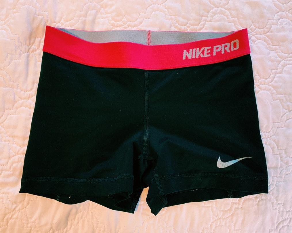 black nike pro shorts with pink band