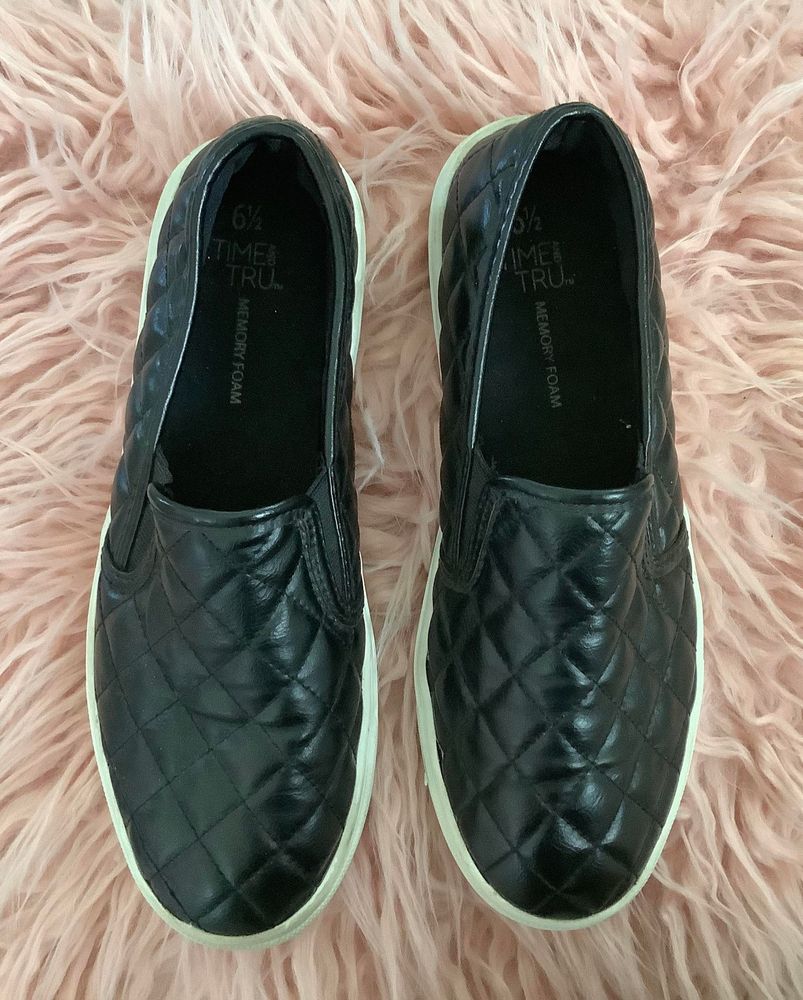 black faux leather slip on sneakers