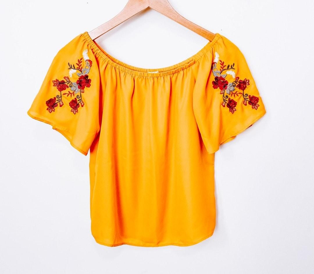 yellow embroidered blouse
