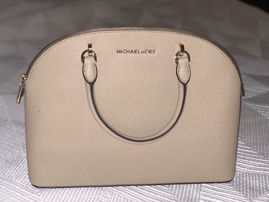 cream colored michael kors purse