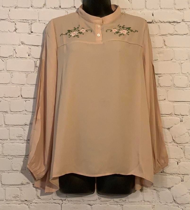 cream flowy top