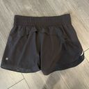 Athleta  High Rise Mesh Racer Run 3" Short in Black Size Medium Photo 2