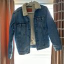 Levi’s Sherpa-Lined Denim Trucker Jacket Photo 0