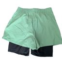 We Wore What  layered green black spandex running shorts Photo 3