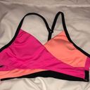 PINK - Victoria's Secret PINK Sport swim suit bikini top orange and pink in color size small spor…​ Photo 1