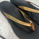 Olukai  Ho'Opio Womens Gold Black Slip On Thong Sandals Photo 1