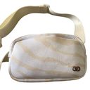 Calia by Carrie UNDERWOOD  White and cream color waist/belt bag, adjustable, top zip closure, inside zip pocket, measures 7.5 x 5 inches Photo 1