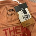 The North Face  orange t shirt Photo 1