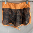 The North Face  Orange and Grey Running Shorts Size XS Photo 0