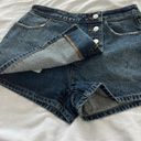 Urban Outfitters denim skort Size 26 Condition: NWT  Color: Blue   Details : - Button down front  - Hidden button and zipper closure  - Comfy  Extras: -  I ship between 1-2 days  Photo 3
