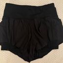 Lululemon size 2 high waisted limited edition flowey shorts with spandex under Photo 0