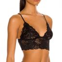 Free People Black Everyday Lace Longline Bralette 2-Pack Bra Set, Size M  This bralette set from  is perfect for those who love the festival, hippie, and boho styles. Made with a semi-sheer lace material, it comes in black and features adjustable spaghetti straps. This wireless bralette set has a pullover closure and is available in size M.  The garment care instructions recommend hand washing only. The bralette set includes two longline bralettes and is made of 84% polyamide and 16% elastane. The set is perfect for adding a touch of bohemian style to your wardrobe, and is a great addition for any woman's intimates collection. Photo 4