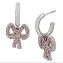 Coach  Antique Huggie Bow Earrings, Silver Tone, Pink Photo 1