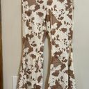 Altar'd State Flare Cowprint Jeans Photo 1