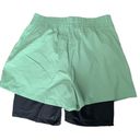 We Wore What  layered green black spandex running shorts Photo 4